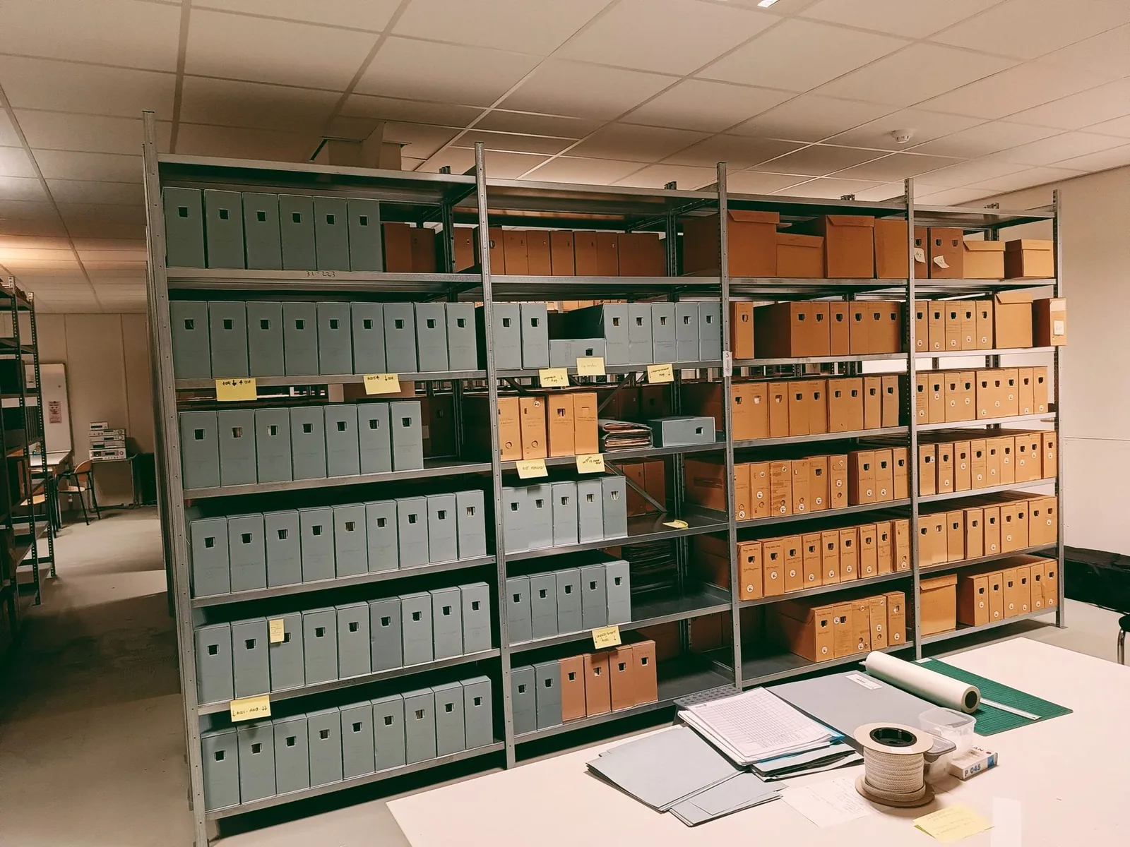 Archive cabinets, document boxes and working materials in the Museum Maluku depot